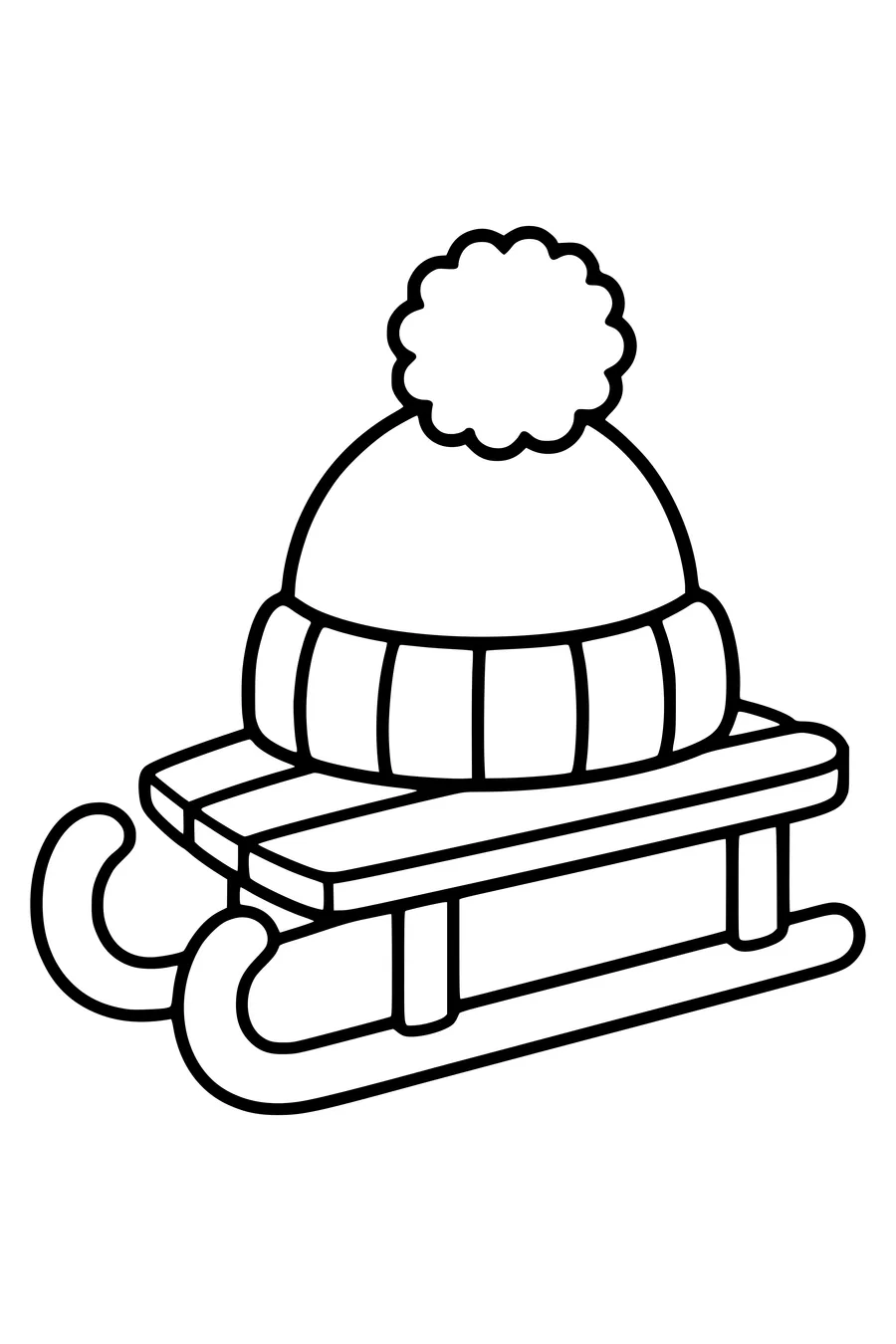 Op een klein houten sleetje ligt een muts met een grote pompon.