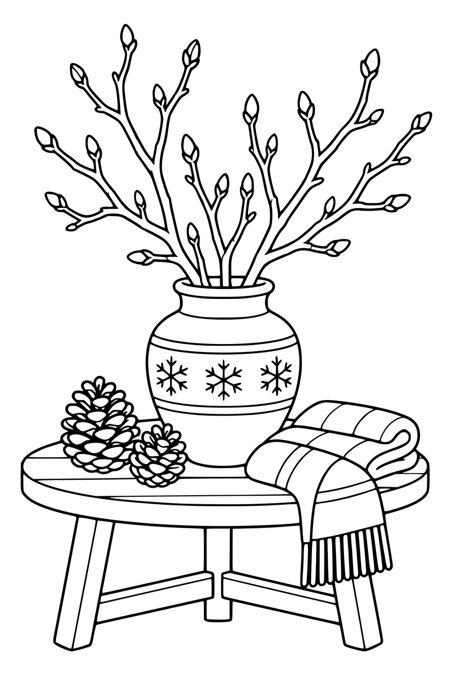 Bare winter branches with visible buds stand in a broad vase beside pine cones and a folded scarf on a table.